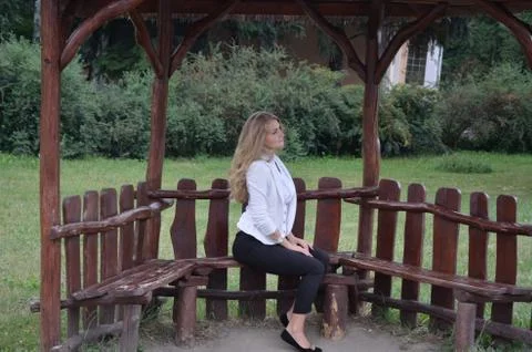 Girl posing sitting Stock Photos