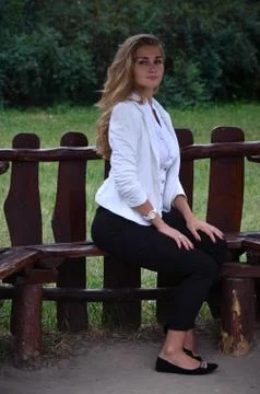 Girl posing sitting Stock Photos