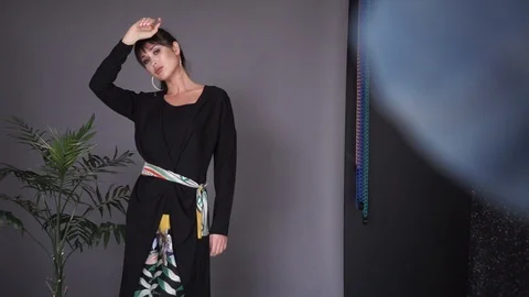 Girl posing in the studio.  Italian clothes for girls Video stock 106026331