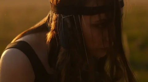Girl posing at sunset in field Видео 63110480