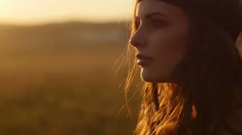 Girl posing at sunset in field Stock Footage 63110544