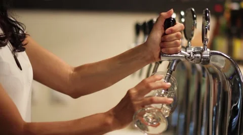 Girl Pouring Draft Beer Medium Shot Stock Footage 65997688