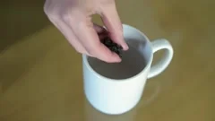 Pouring hot boiling water into cup or mu, Stock Video