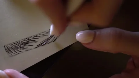 Girl practices permanent makeup microblading on fake skin. Stock Footage 142363103