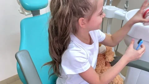 Girl is practicing how to properly brush her teeth. Good oral hygienist Stock Footage 268978415