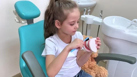 Girl is practicing how to properly brush her teeth. Good oral hygienist Stock Footage 268978596