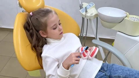 Girl is practicing how to properly brush her teeth. Good oral hygienist Stock Footage 268978646