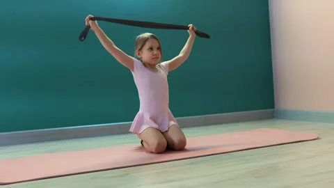 Girl practicing stretching with strap Video stock 327715730