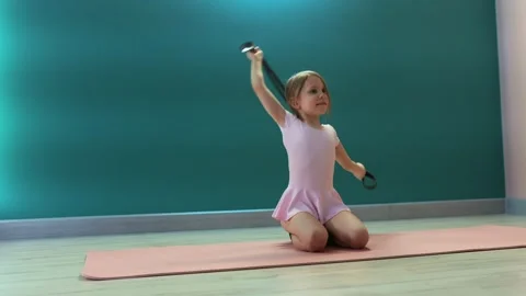 Girl practicing stretching with strap Stock-Footage 327715941
