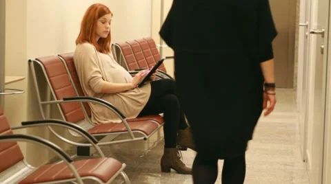 Girl in pregnant in the firm with tablet Stock Footage