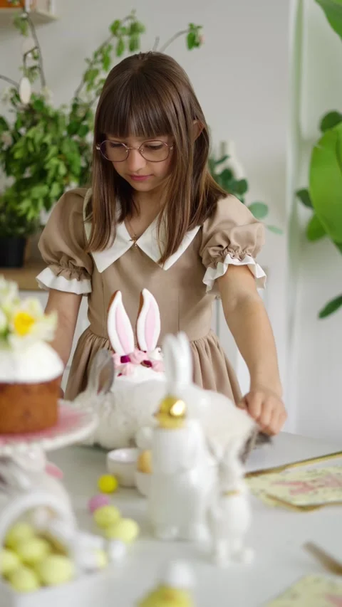 Girl prepares Easter table. Concept of celebrating Easter. Stock Footage 275545444