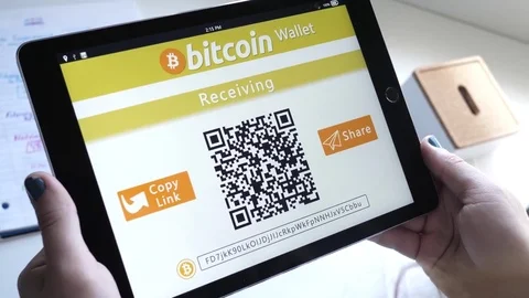 Girl Preparing To Receive Bitcoin On Her Tablet Device Showing QR Code Stock Footage