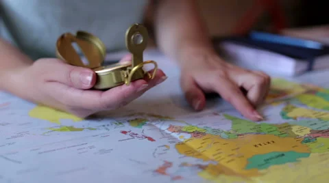 Girl preparing to travel using the map Stock Footage 64237588