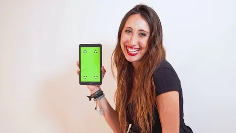 Girl presenting an app on a tablet Stock Footage 78696188