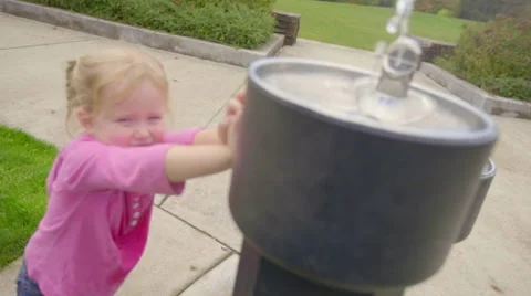 Girl presses button until dad comes and drinks Stock Footage 58490119