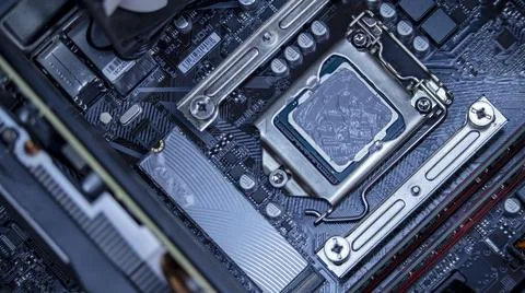 Girl programmer apply thermal paste on the computer processor, 写真素材