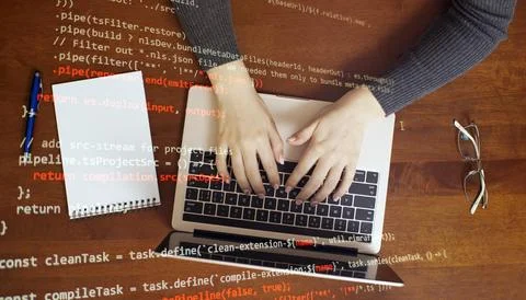 Girl programmer at home writes programming code script on virtual screen Foto stock