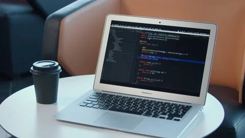 Girl programmer photographs her code on a smartphone Stock Footage 150326191