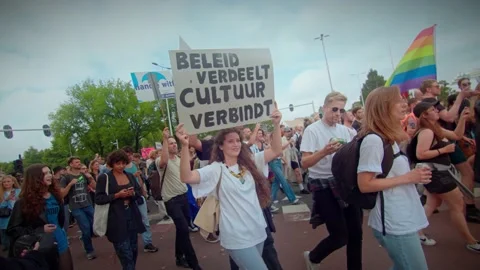 Girl Protesting in walking crowd against corona Stock Footage 160899831