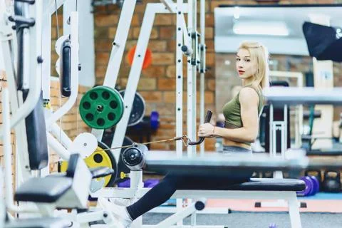 Girl pull her back in simulator Stock Photos