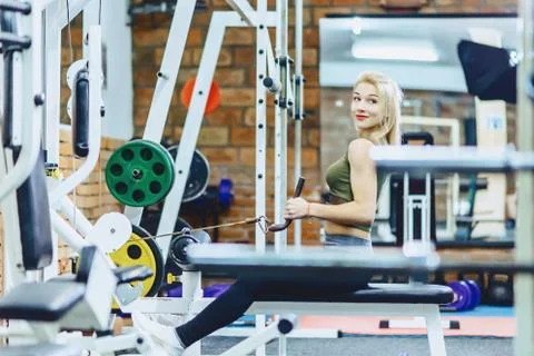 Girl pull her back in simulator Stock Photos