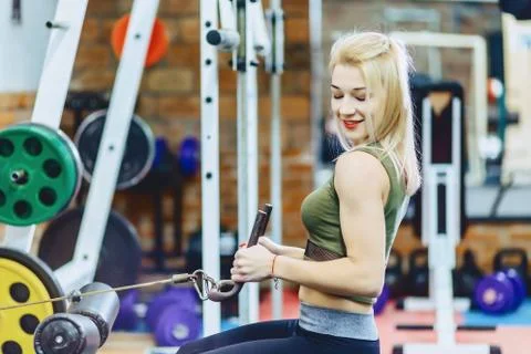 Girl pull her back in simulator Stock Photos