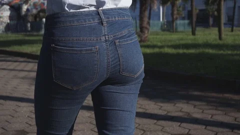 Girl pulls and puts back in pocket stack of bills Video stock 70947675