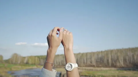 The girl pulls hands to the sky. Slow motion Видео 61491785