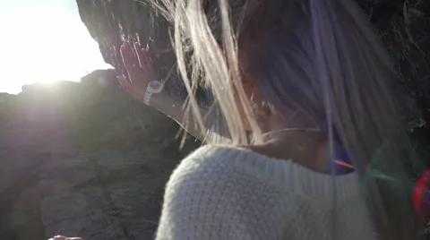 The girl pulls hands to the sun Stock Footage 61459995