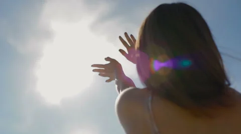 The girl pulls hands to the sun Stock Footage 62548432