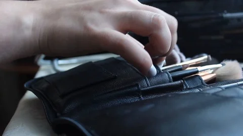 The girl pulls out a brush to make up before the wedding Stock Footage 123348014