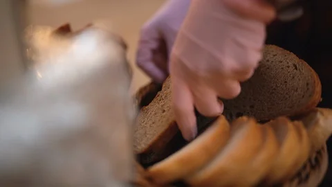 Girl puts bread in the basket 스톡 동영상 124031145