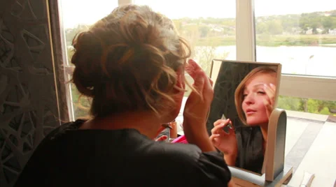 Girl Puts Makeup Stock Footage 33653872