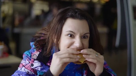 The girl ran into the cafe from the street, that would quickly eat. The brunette Stock Footage