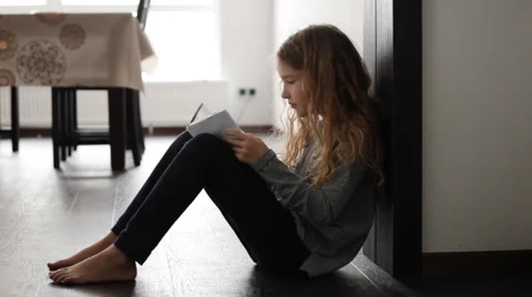 Girl reading book Stock Footage