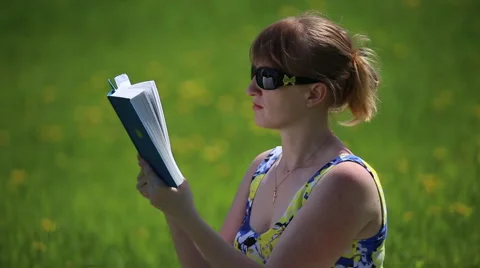 Girl reading a book Stock Footage 62932327