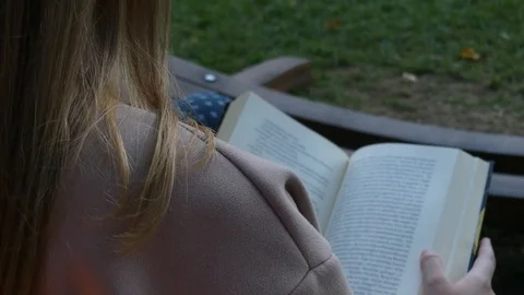 Girl reading a book Stock Footage