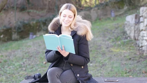 Girl reading a book Stock Footage 102468286