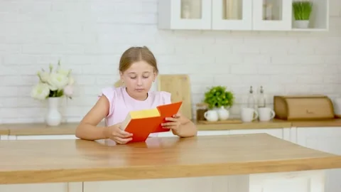 Girl reading a book Stock Footage 160318882