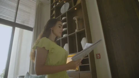 Girl is reading newspaper Stock Footage 93543559