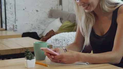 The girl is reading something in her mobile phone Stock-Footage 80471504
