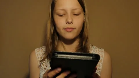 Girl reads e-book e-reader. 4K UHD Видео 65160245