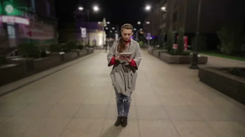 Girl in real time using tablet on the street timelapse background. Stock Footage 56339321