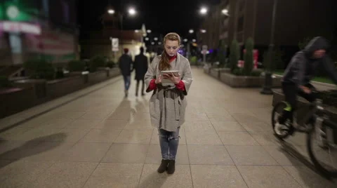 Girl in real time using tablet on the streets, that stopped in time. Stock Footage 56339463
