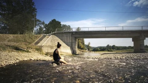 Girl Resting in River Stock Footage 78848890