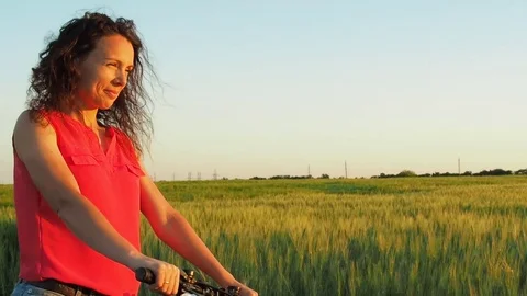 Girl riding a bike outdoors. Stock Footage