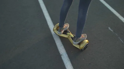 Girl riding on hoverboard close up Vídeo Stock 63826320