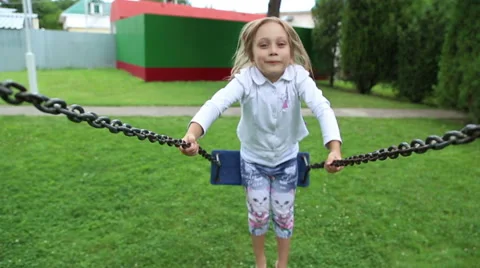 Girl riding on a swing Stock Footage 52431955