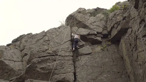Girl rock climber Stock Footage