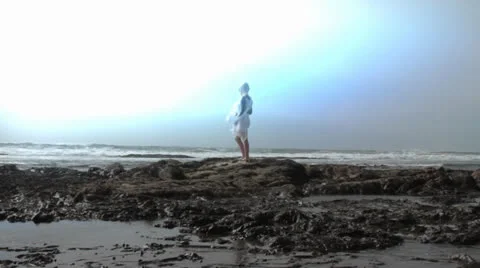 Girl on Rocks at Beach Stock Footage 22575590